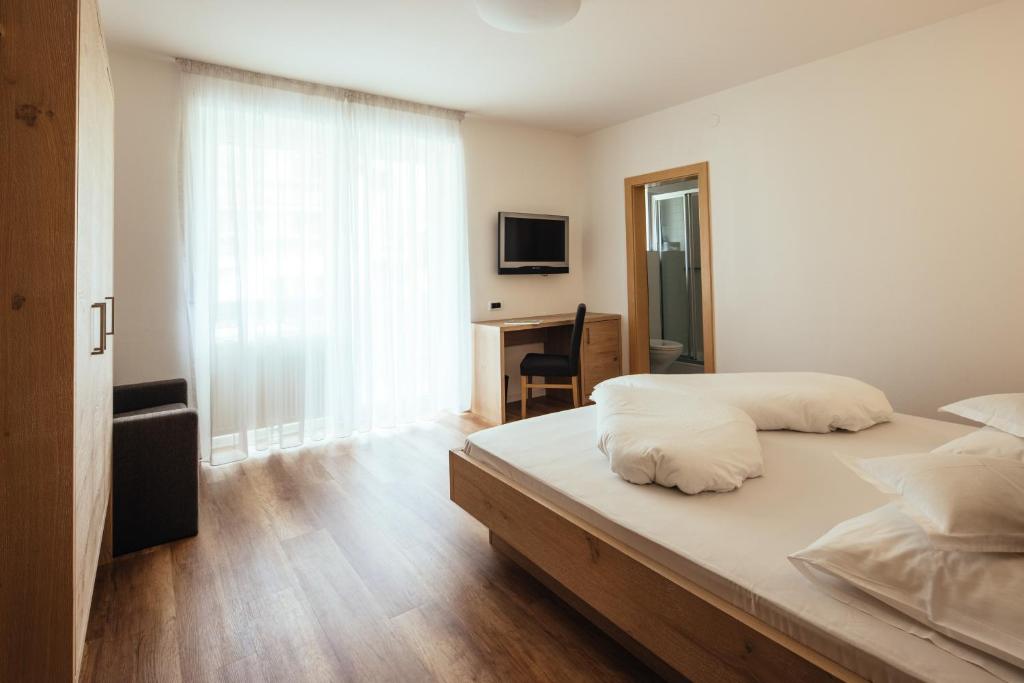 Postel nebo postele na pokoji v ubytování Hotel Rablanderhof
