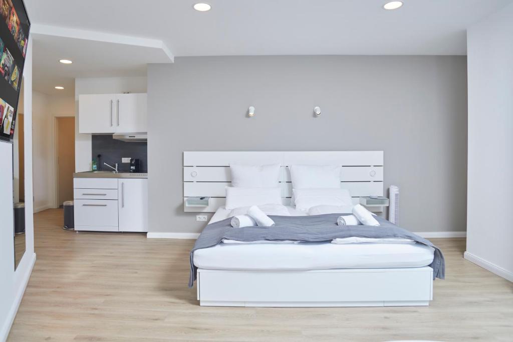 Postel nebo postele na pokoji v ubytování Hamburg Nord Apartments