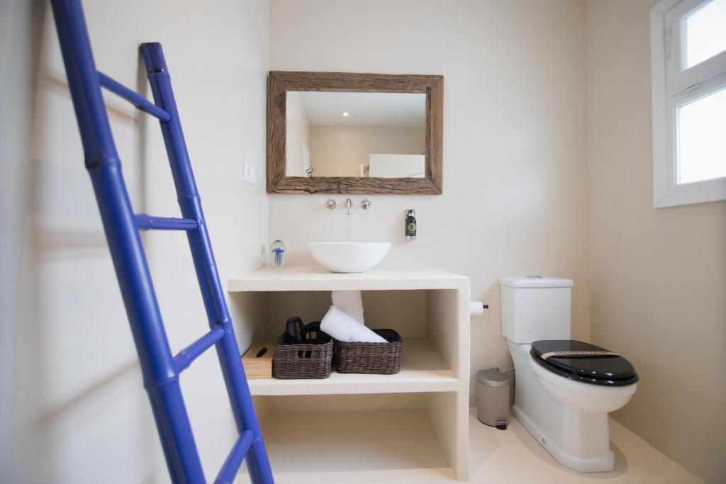 a ladder in a bathroom with a sink and a toilet at Quinta la Sal in Jávea