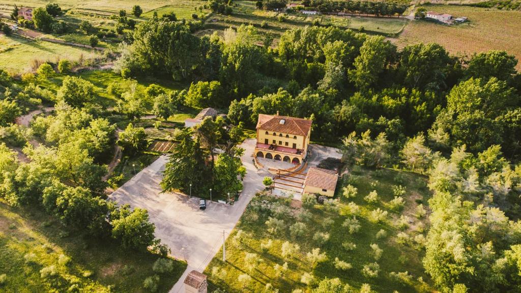 an aerial view of a house in a field at Mas Trucafort - Masia Braseria - Alojamiento Adults only in Falset