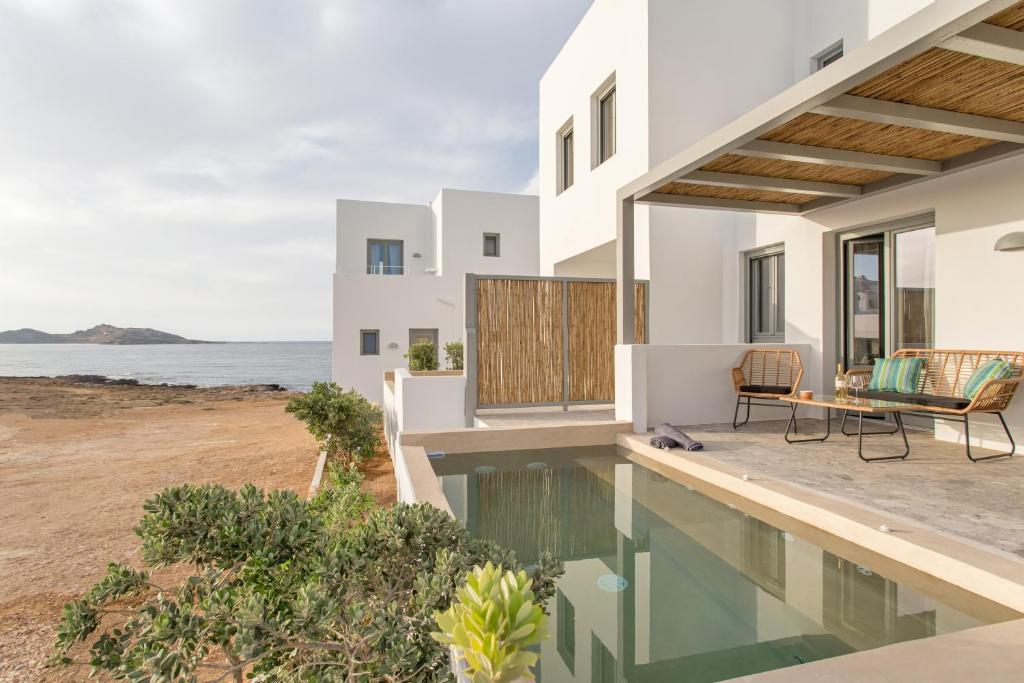a villa with a view of the ocean at Paros Cape Suites in Naousa