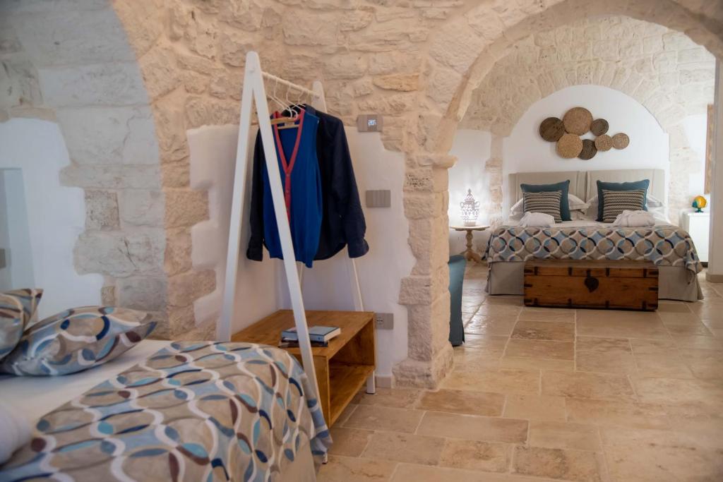 Voodi või voodid majutusasutuse Chiancole - Trulli Experience toas