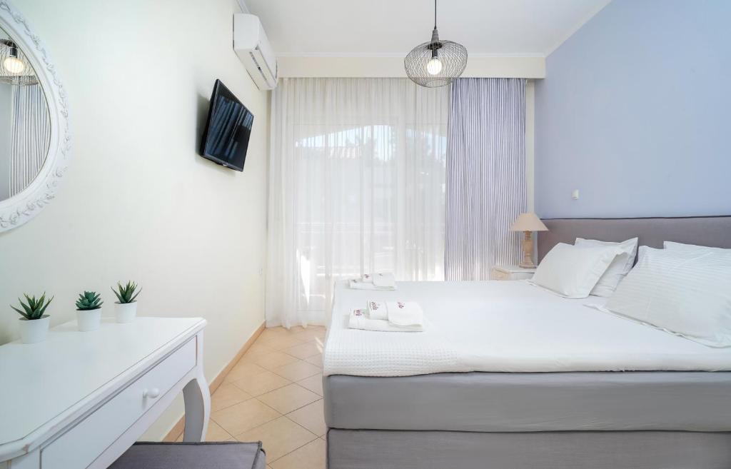 Postel nebo postele na pokoji v ubytování Aelia Villa