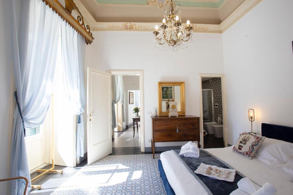 Łóżko lub łóżka w pokoju w obiekcie Palazzo d'Autore - Luxury Home - Ragusa Centro