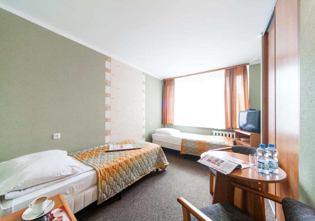 Posteľ alebo postele v izbe v ubytovaní Hotel Mazowiecki Łódź