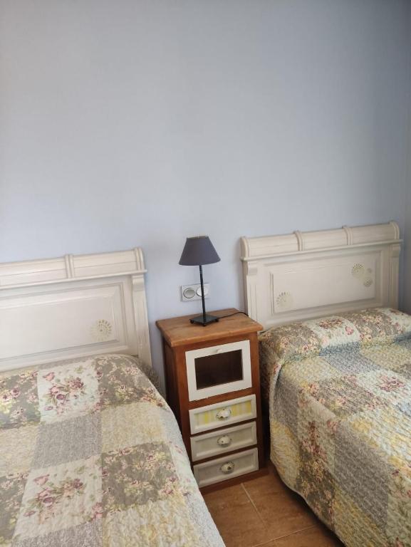 Posteľ alebo postele v izbe v ubytovaní Apartamentos Costa Noja