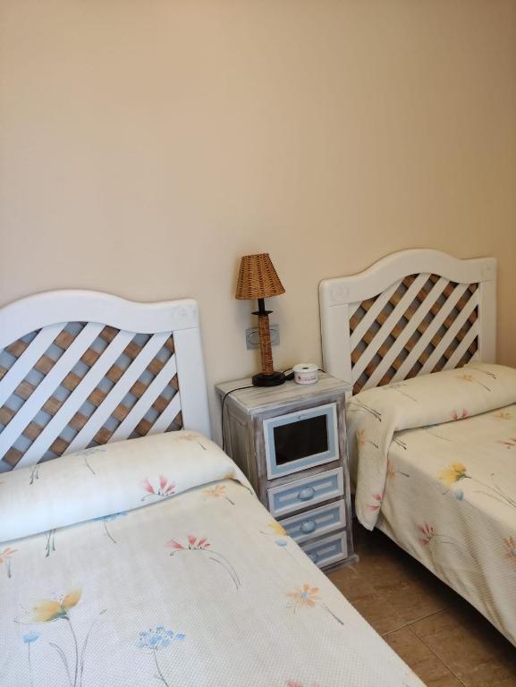 Posteľ alebo postele v izbe v ubytovaní Apartamentos Costa Noja