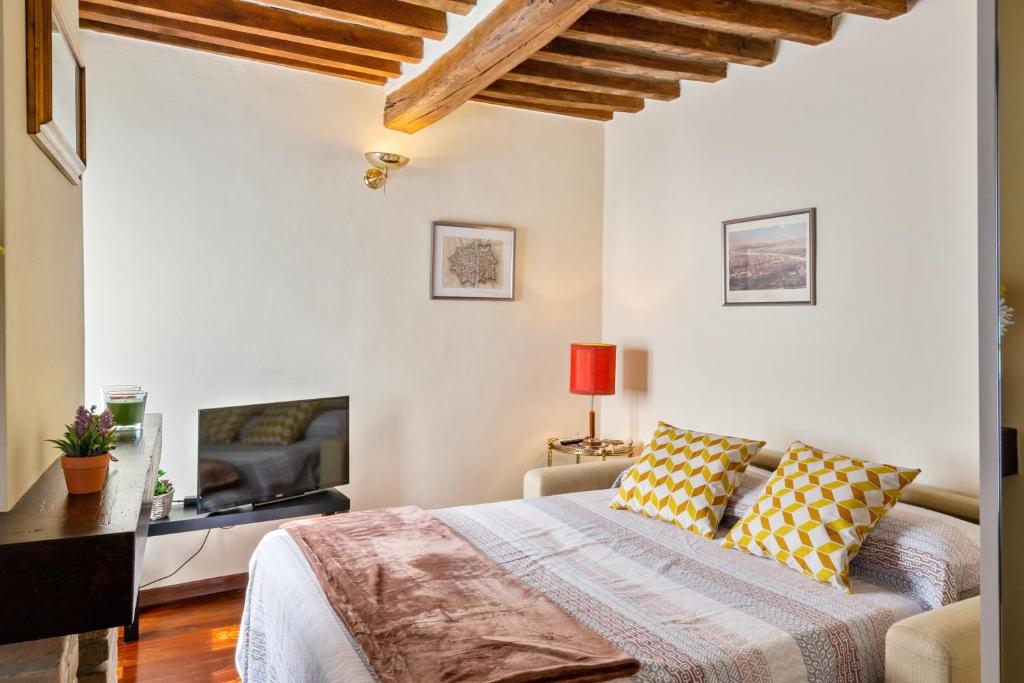 Postel nebo postele na pokoji v ubytování Parma Oltretorrente Cozy Minihouse