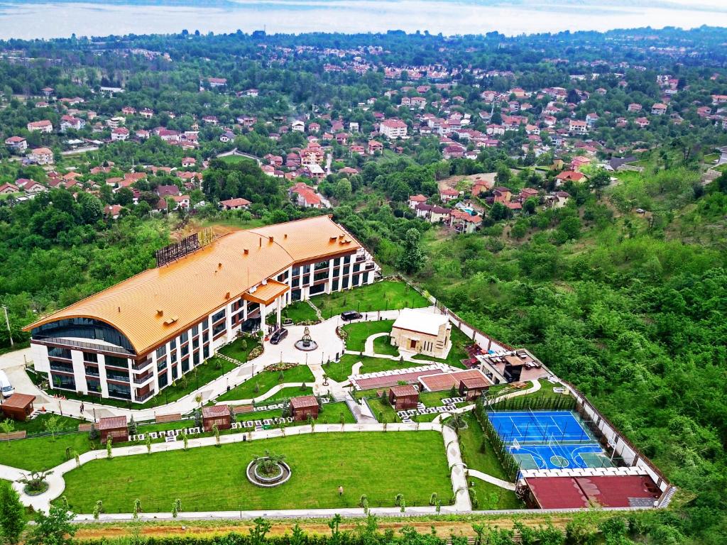 an aerial view of a building with a swimming pool at Cabir Deluxe Hotel Sapanca in Sapanca