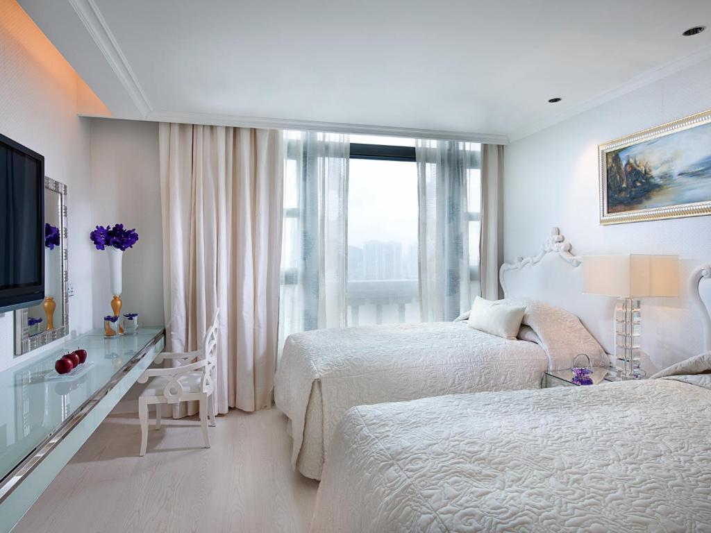 Postel nebo postele na pokoji v ubytování Sofitel Macau At Ponte 16