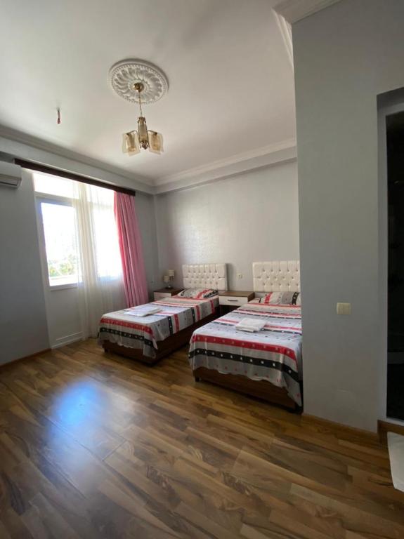 Postel nebo postele na pokoji v ubytování Hotel Eurasia