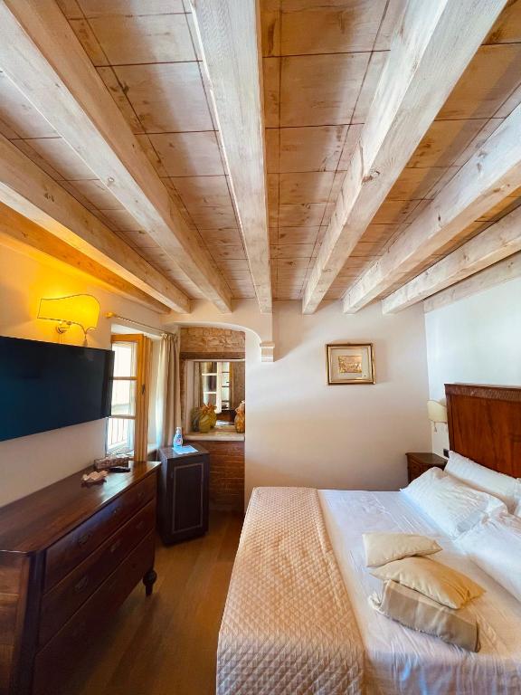 Postel nebo postele na pokoji v ubytování Locanda Lo Scudo