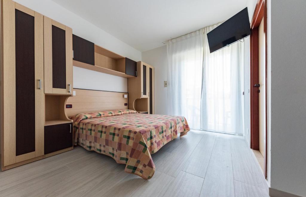 A bed or beds in a room at Residence Renadoro