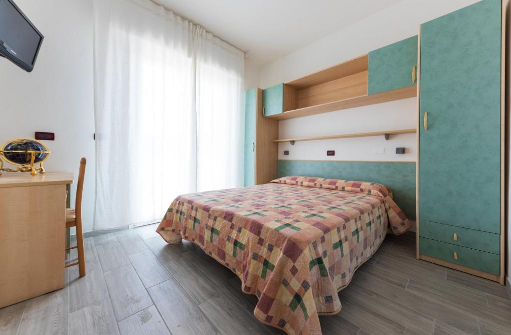 A bed or beds in a room at Residence Renadoro