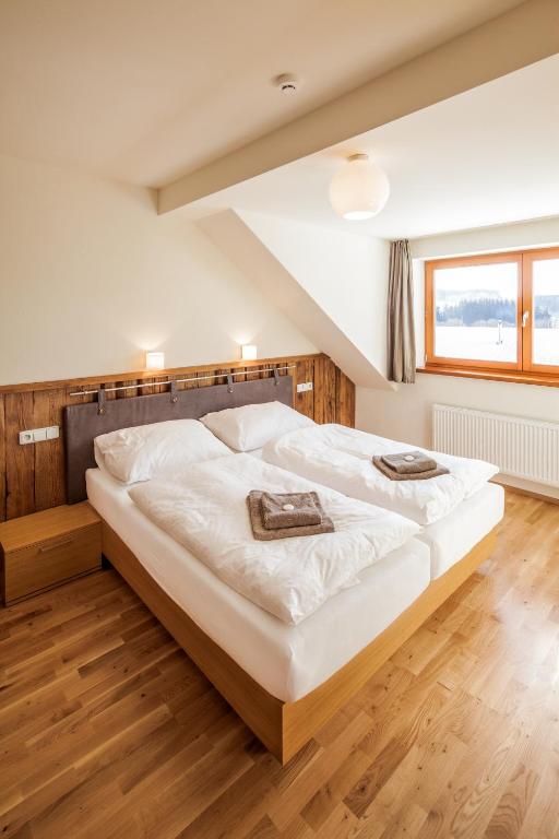 Postel nebo postele na pokoji v ubytování Resort Líšenský Dvůr