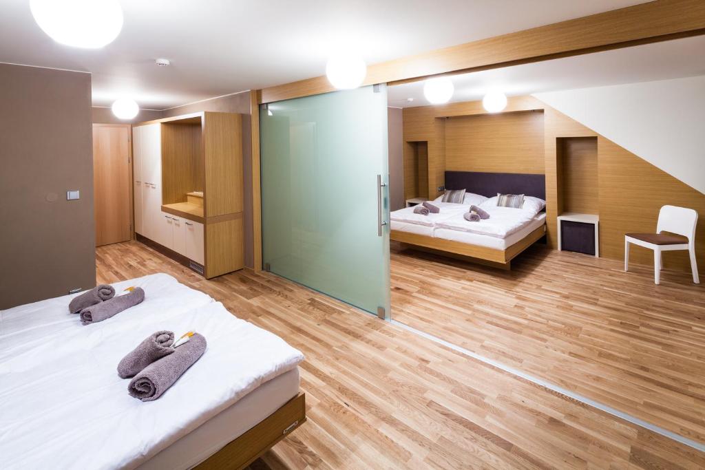 Postel nebo postele na pokoji v ubytování Resort Líšenský Dvůr