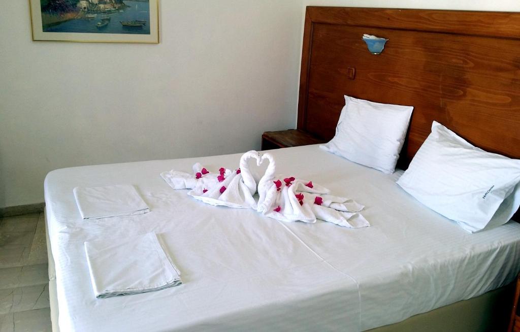 Postel nebo postele na pokoji v ubytování Denise Hotel