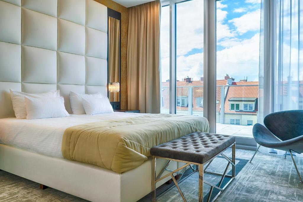 Posteľ alebo postele v izbe v ubytovaní Grand Focus Hotel Szczecin