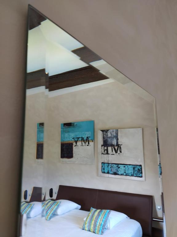 Postel nebo postele na pokoji v ubytování Auberge Du Roua