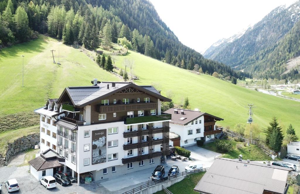 an aerial view of a building in the mountains at Aktivhotel Feichtner Hof in Kaunertal