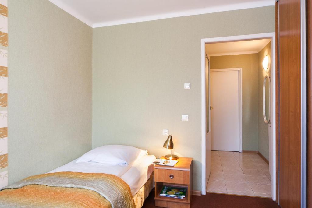 Posteľ alebo postele v izbe v ubytovaní Hotel Mazowiecki Łódź