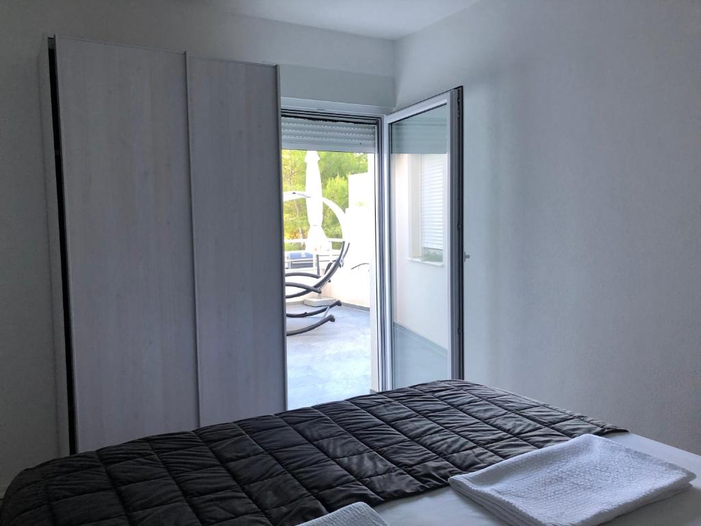 Postel nebo postele na pokoji v ubytování Ada Vis Apartments