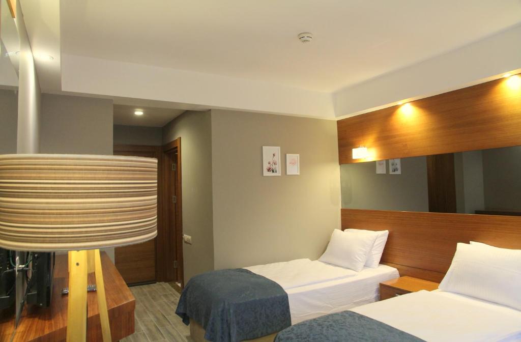 Кровать или кровати в номере Kilpa Hotel