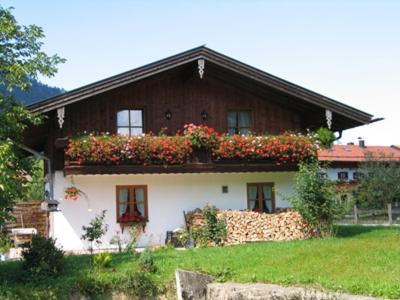 a house with flower boxes on the side of it at Feichten-Hof Zuhaus Familie Zaiser in Schleching