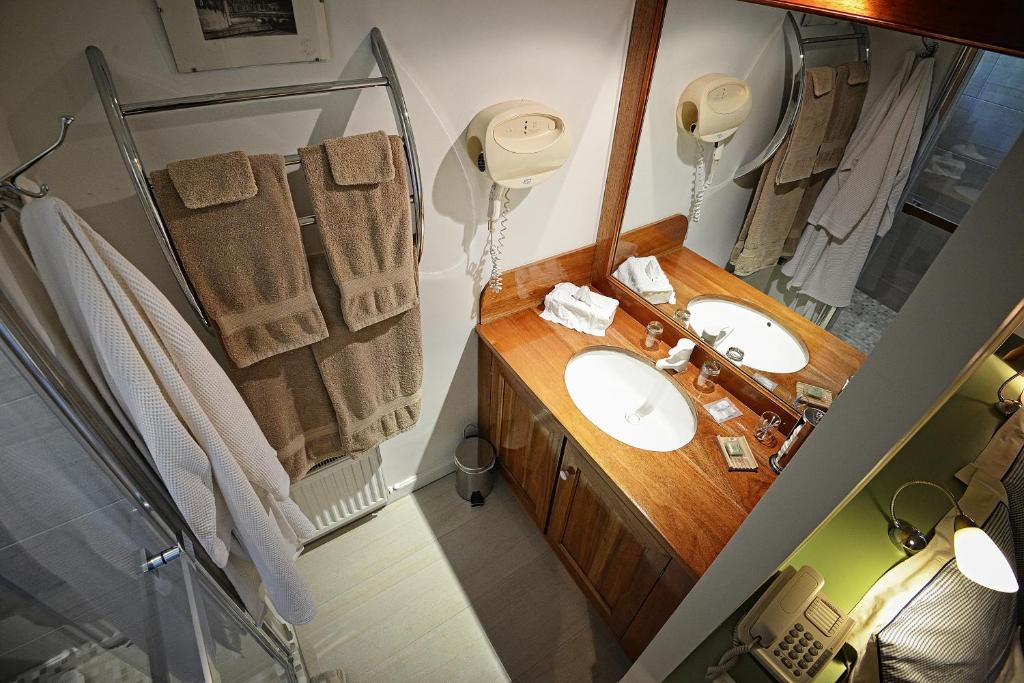 Postel nebo postele na pokoji v ubytování Hotel Le Clos Raymi