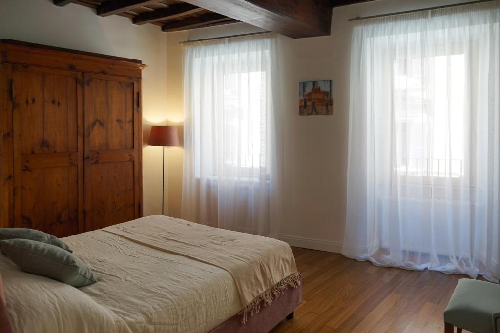 Łóżko lub łóżka w pokoju w obiekcie Barberini Apartment