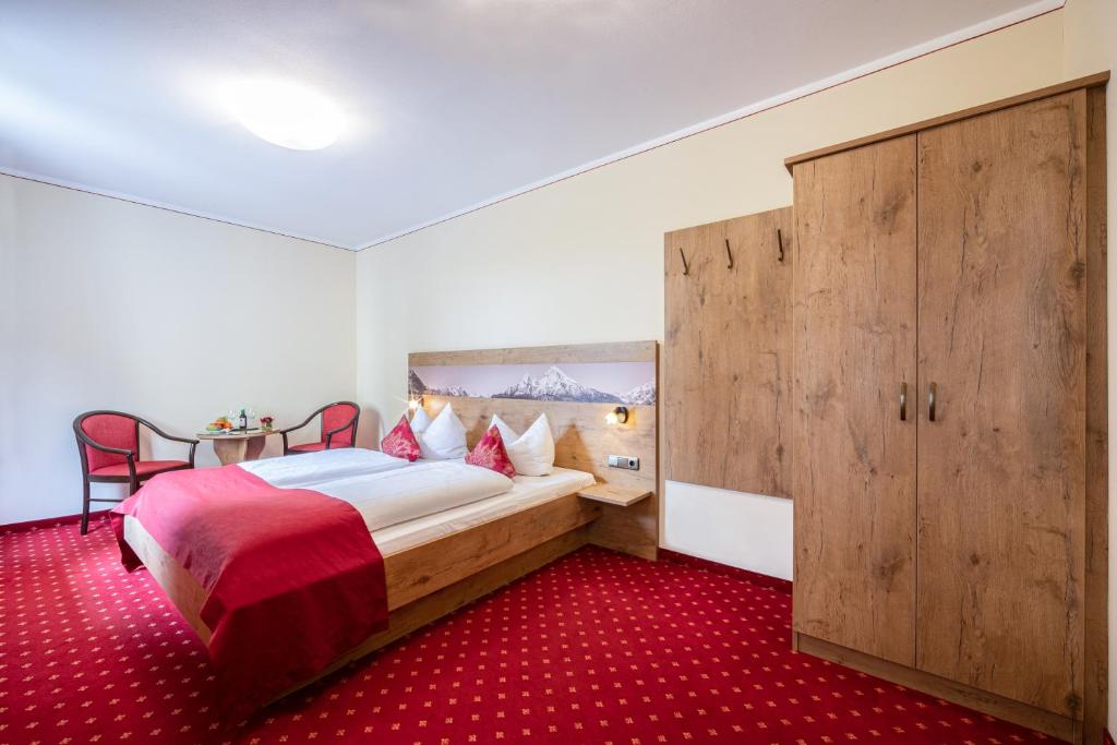 Postel nebo postele na pokoji v ubytování Hotel AlpinaRos