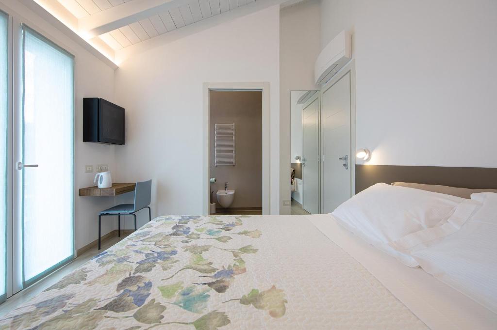 Postel nebo postele na pokoji v ubytování ARIA Design B&B Levanto