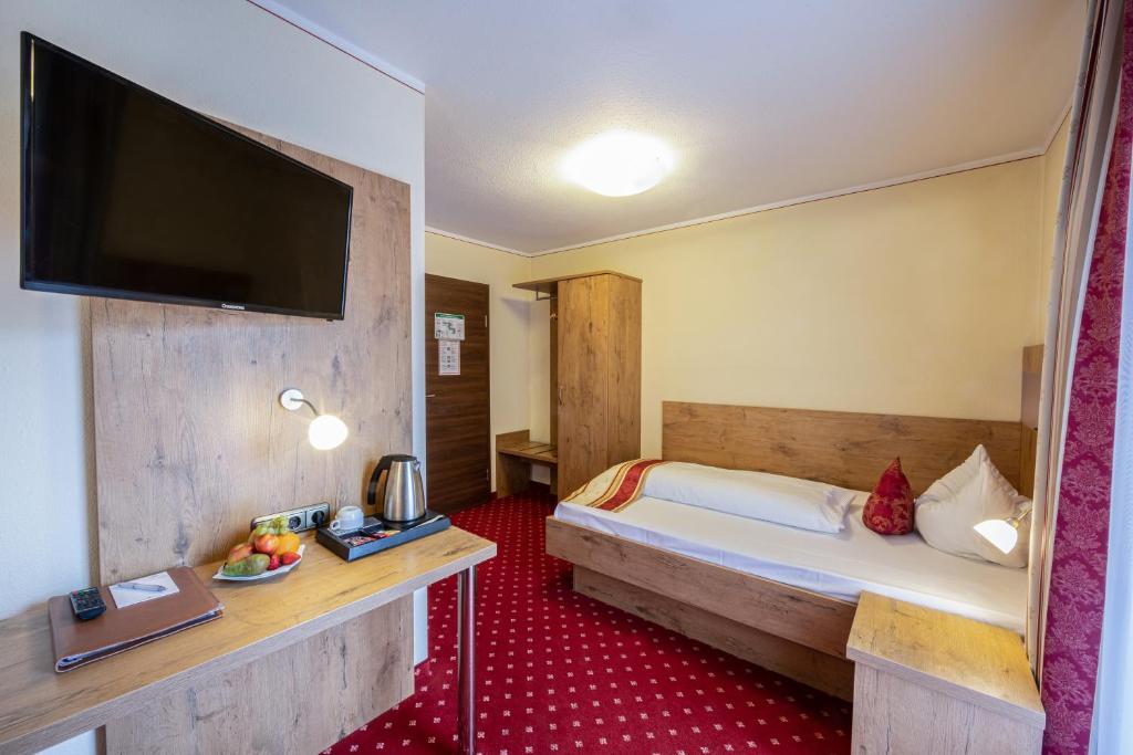 Postel nebo postele na pokoji v ubytování Hotel AlpinaRos