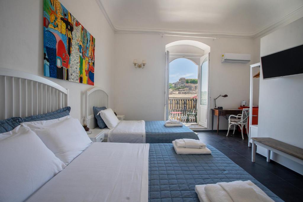 Voodi või voodid majutusasutuse Bed and Breakfast Terra del Sole Ibla toas