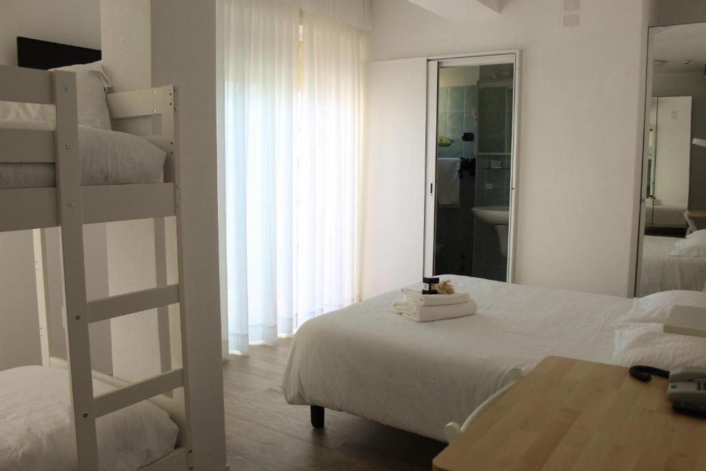 Postel nebo postele na pokoji v ubytování Hotel Venezuela