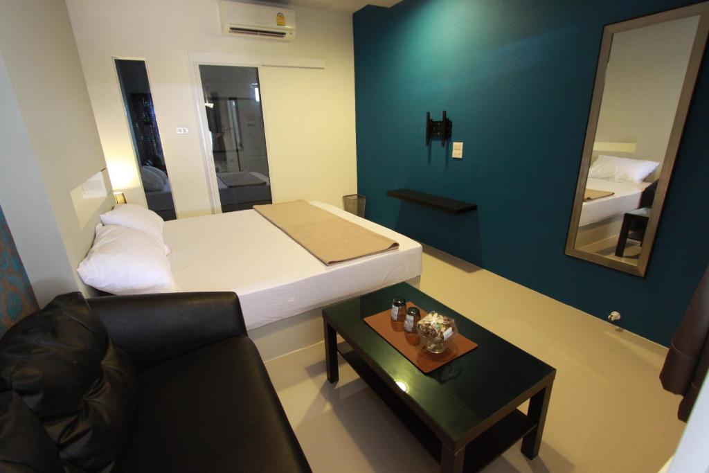 Postel nebo postele na pokoji v ubytování Bearing26 Hotel