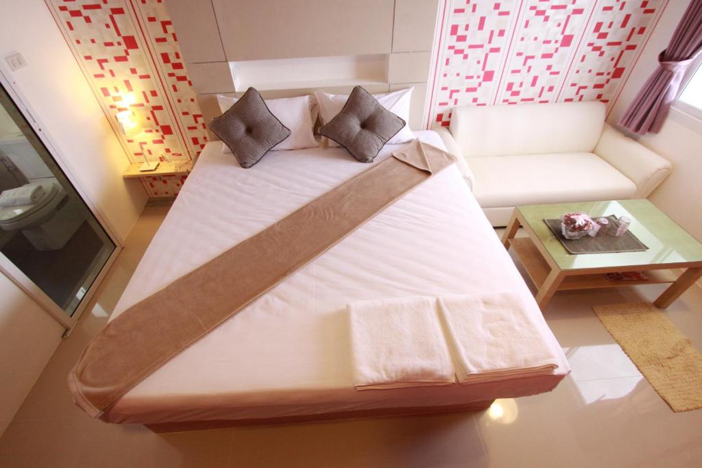 Postel nebo postele na pokoji v ubytování Bearing26 Hotel