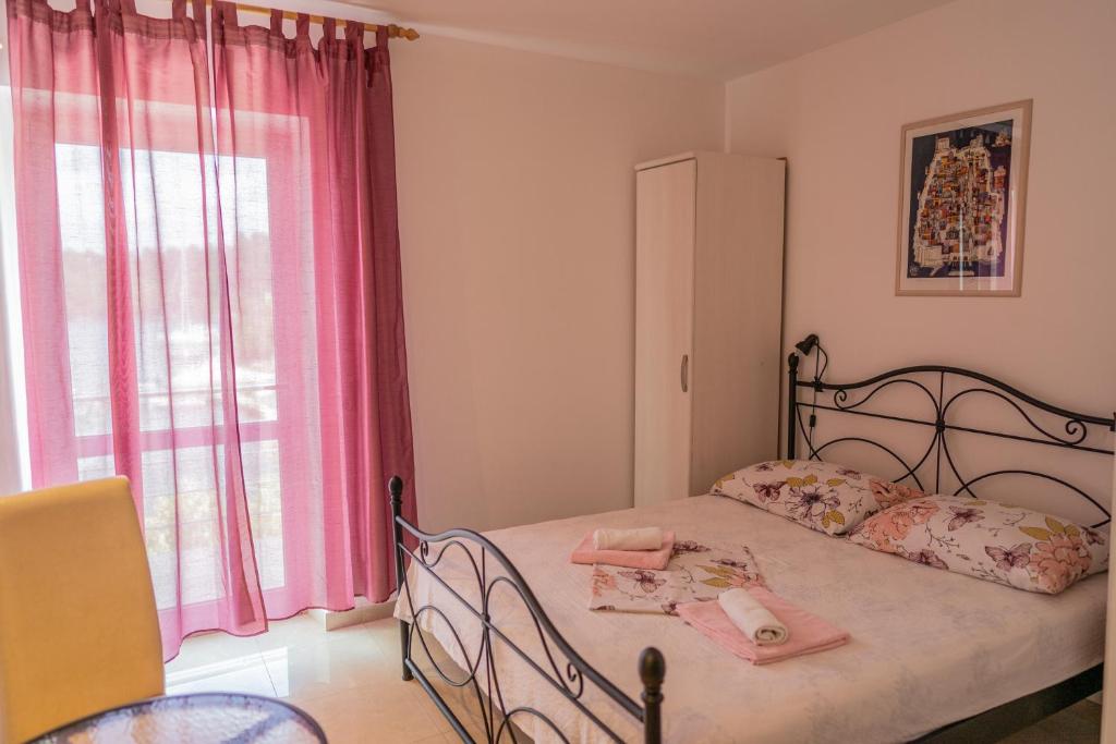 Postel nebo postele na pokoji v ubytování Guesthouse Kamarin