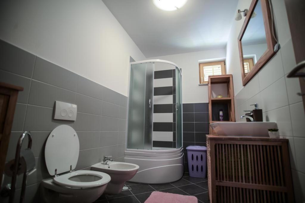 a bathroom with a toilet and a sink at Apartment Cres 4496-1 in Cres