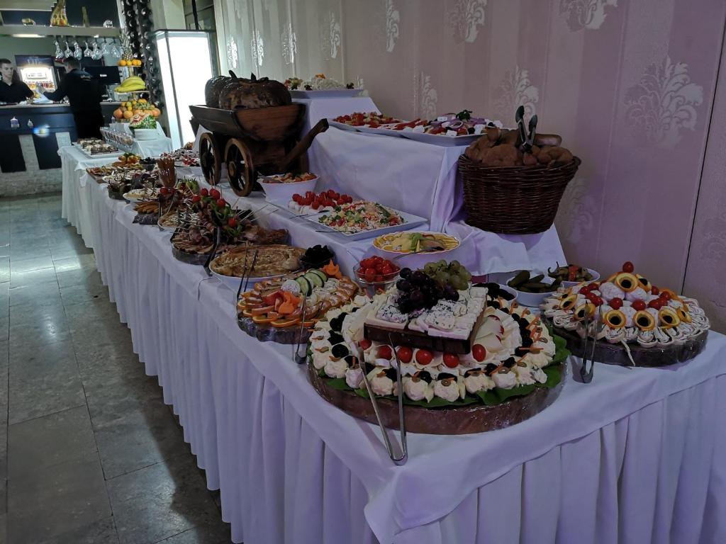 a buffet line with many different types of food at Hotel Royal Drina in Mali Zvornik