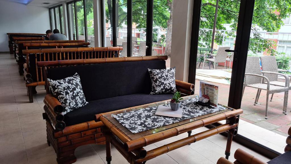 a living room with a couch and a table at Hotel Royal Drina in Mali Zvornik