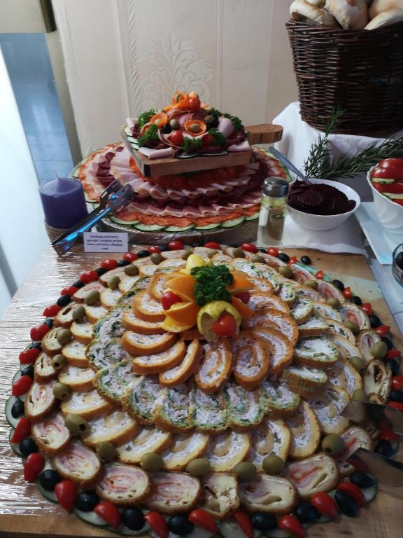a table with a display of food on a table at Hotel Royal Drina in Mali Zvornik
