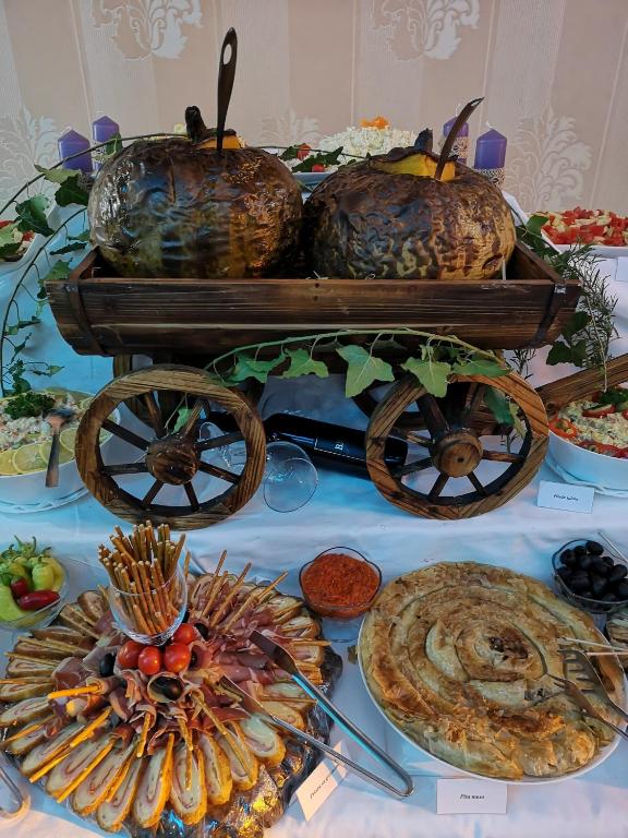 a table with a cart with food on it at Hotel Royal Drina in Mali Zvornik