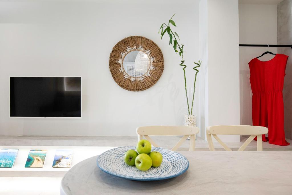 A television and/or entertainment centre at Thalassa Luxury Studios Lindos