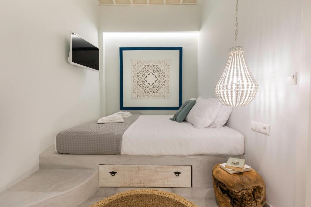 A bed or beds in a room at Thalassa Luxury Studios Lindos