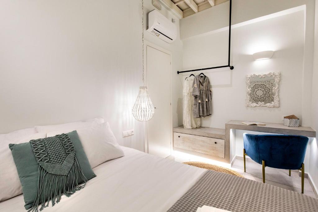 A bed or beds in a room at Thalassa Luxury Studios Lindos