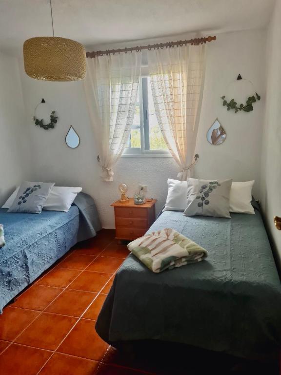 Postel nebo postele na pokoji v ubytování La Casita de la Breña.