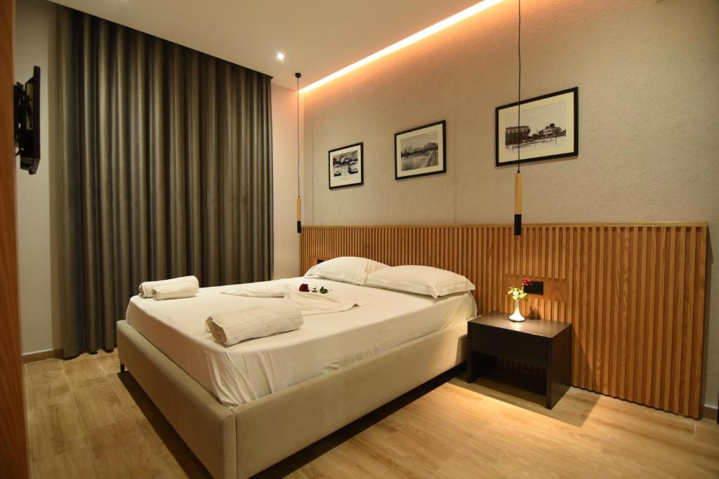 Postel nebo postele na pokoji v ubytování Hotel Ramosaco, Radhimë, Vlorë