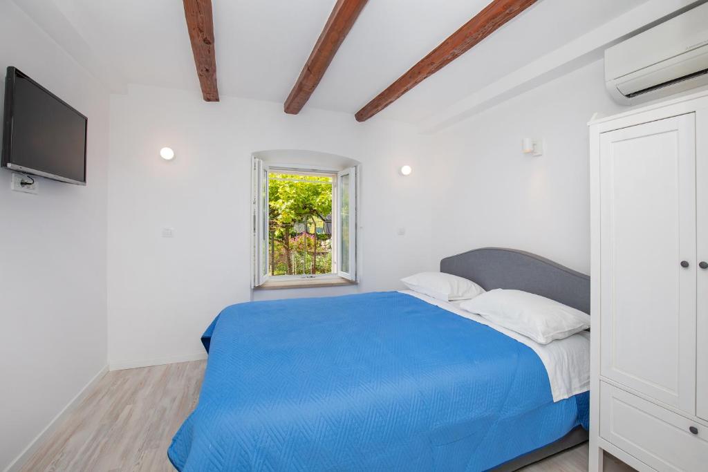 Postel nebo postele na pokoji v ubytování Studio Apartment Bell