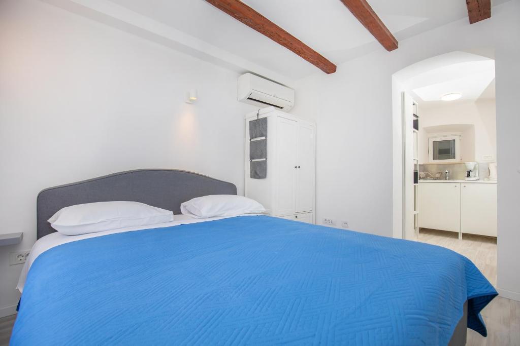 Postel nebo postele na pokoji v ubytování Studio Apartment Bell